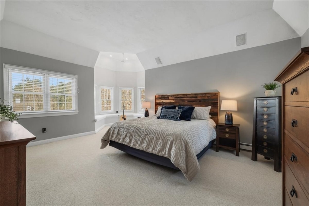 31 Round Hill Road Kingston, MA 02364 - Photo 23 of 42 a spacious bedroom with a bed and wooden floor