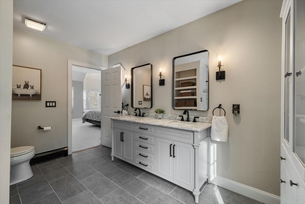 31 Round Hill Road Kingston, MA 02364 - Photo 28 of 42 a spacious bathroom with a double vanity sink a large mirror and a shower