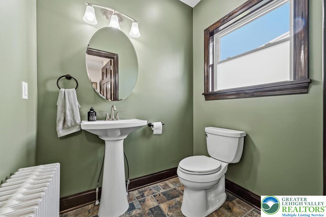 3453 Main Street Slatington, PA 18080 - Photo 10 of 30 A well-appointed lavatory featuring a pedestal sink and tile flooring, offering convenience.