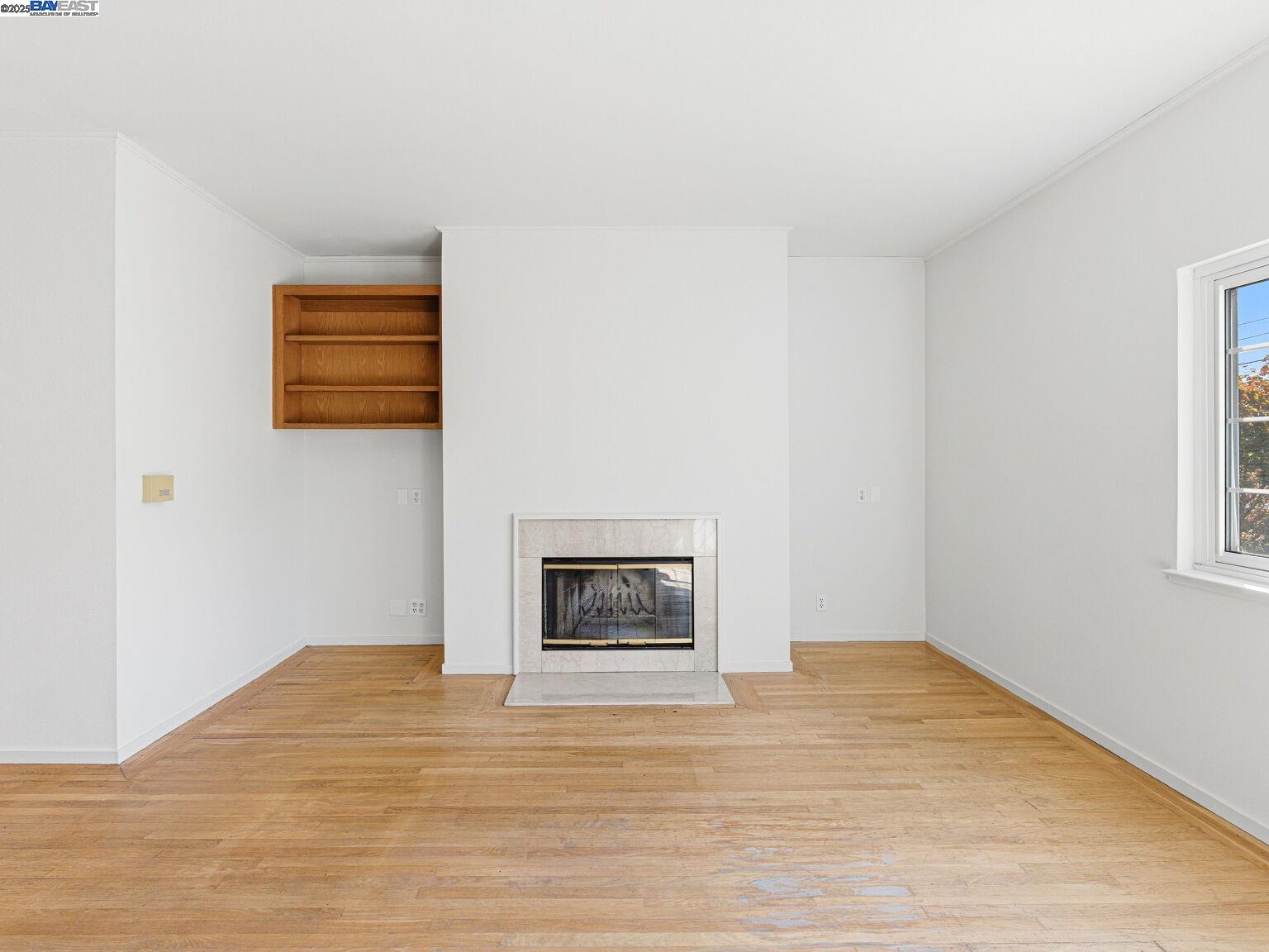 1708 Lexington Avenue, Unit 2 El Cerrito, CA 94530 - Photo 25 of 60 a view of an empty room with wooden floor and a window