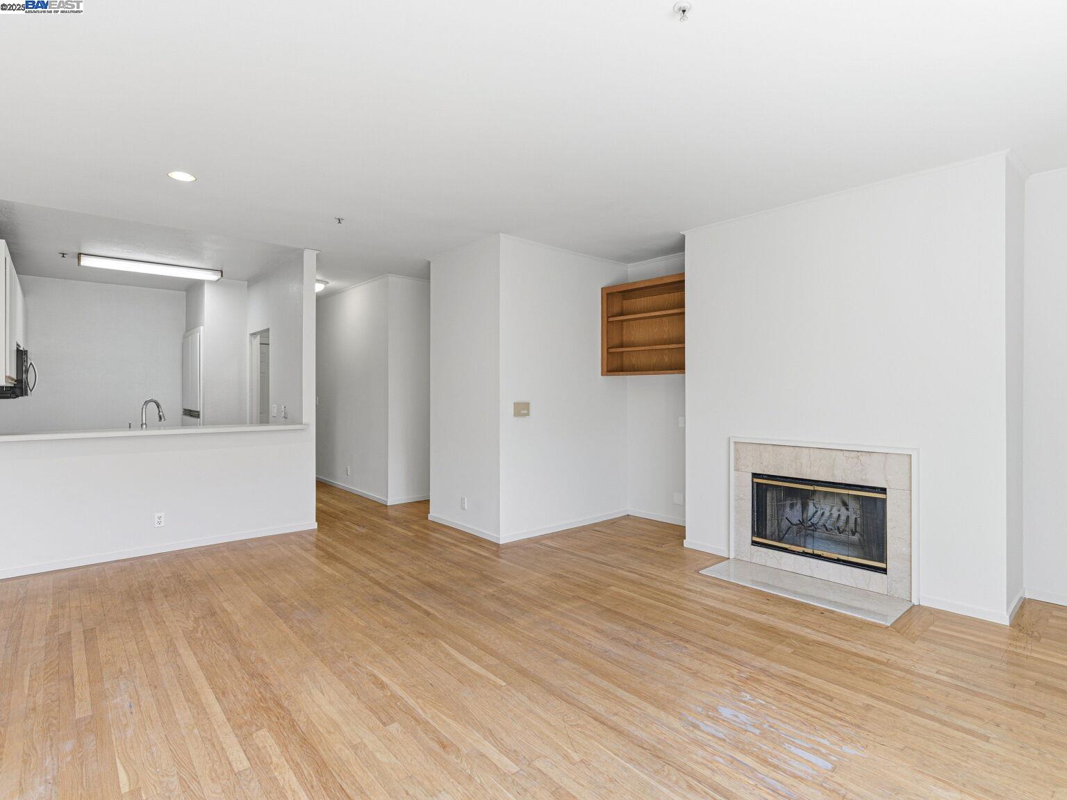 1708 Lexington Avenue, Unit 2 El Cerrito, CA 94530 - Photo 26 of 60 a view of an empty room with wooden floor and a window