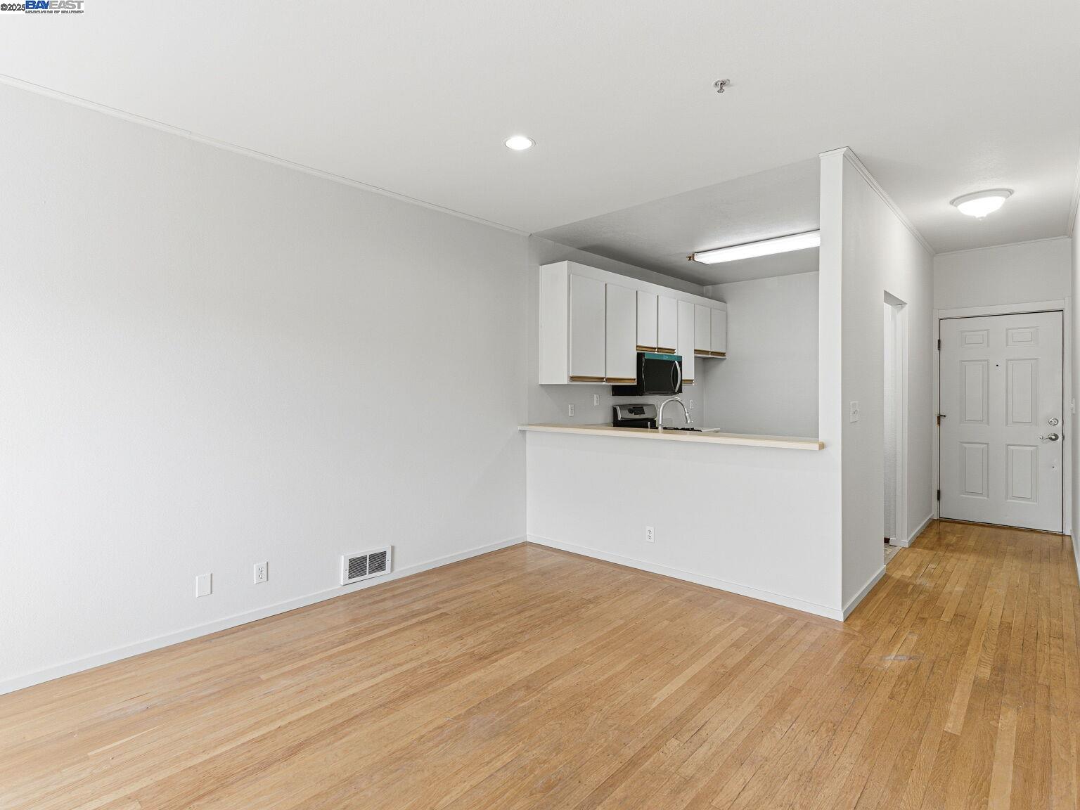 1708 Lexington Avenue, Unit 2 El Cerrito, CA 94530 - Photo 28 of 60 a view of a kitchen with wooden floor