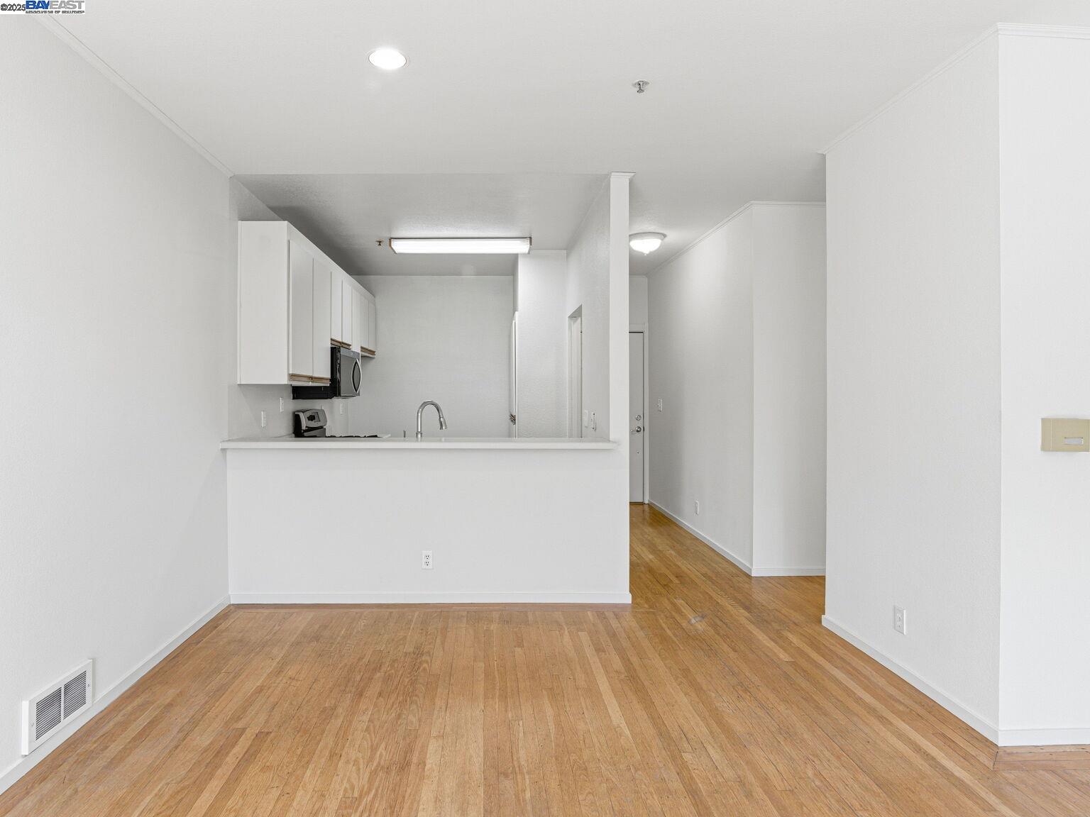 1708 Lexington Avenue, Unit 2 El Cerrito, CA 94530 - Photo 31 of 60 a view of a kitchen with wooden floor and a sink