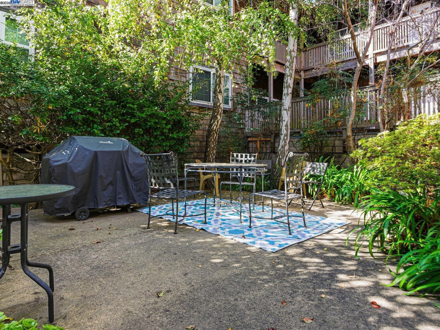 1708 Lexington Avenue, Unit 2 El Cerrito, CA 94530 - Photo 46 of 60 a view of backyard with a table and chairs and potted plants