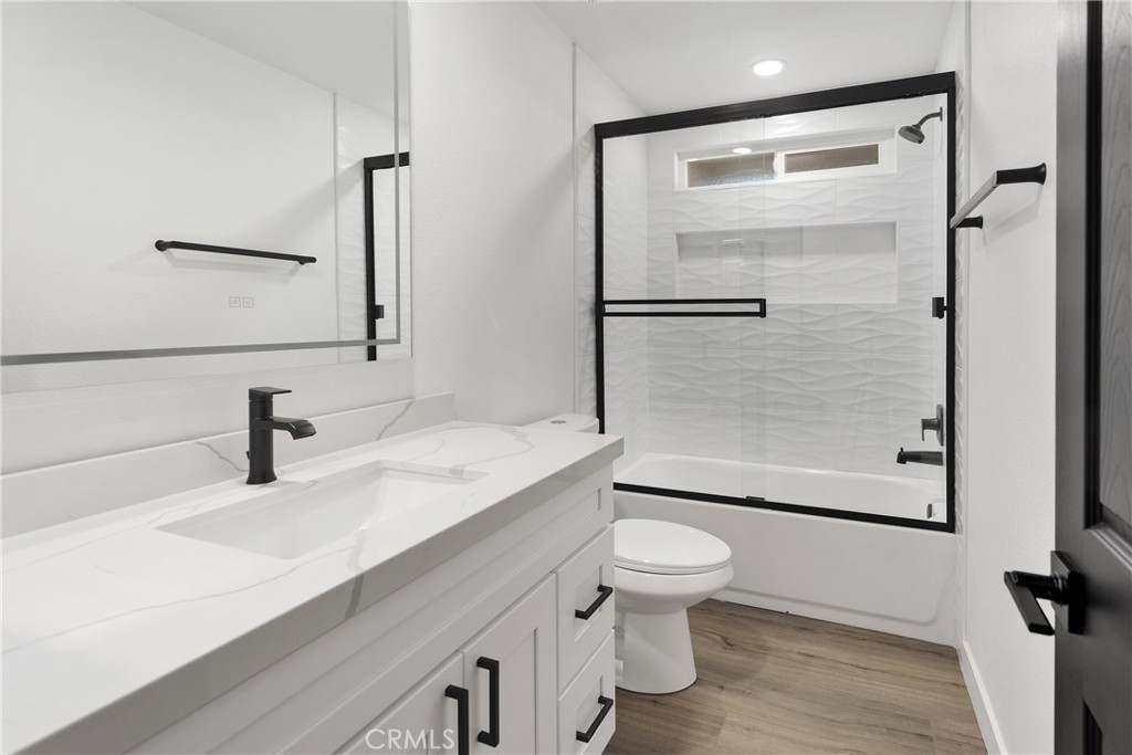 20717 Eyota Apple Valley, CA 92308 - Photo 13 of 38 a bathroom with a sink a toilet and shower