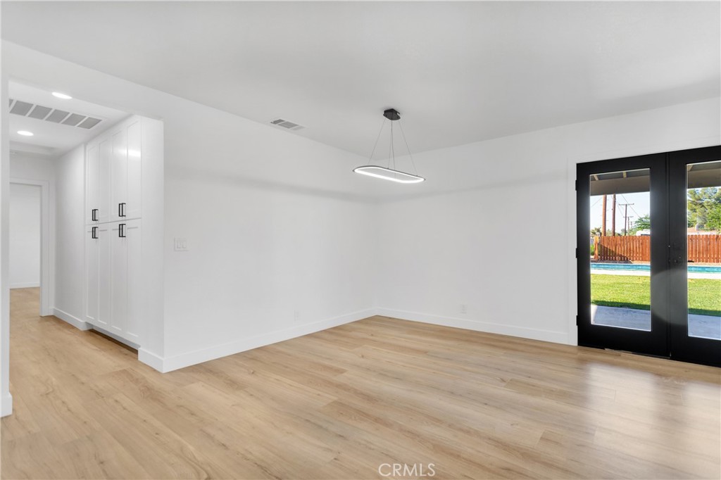 20717 Eyota Apple Valley, CA 92308 - Photo 19 of 38 wooden floor in an empty room with a window