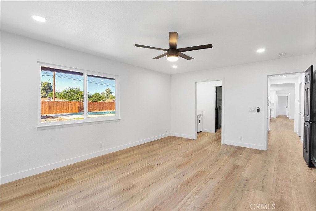 20717 Eyota Apple Valley, CA 92308 - Photo 22 of 38 a view of empty room with wooden floor and fan