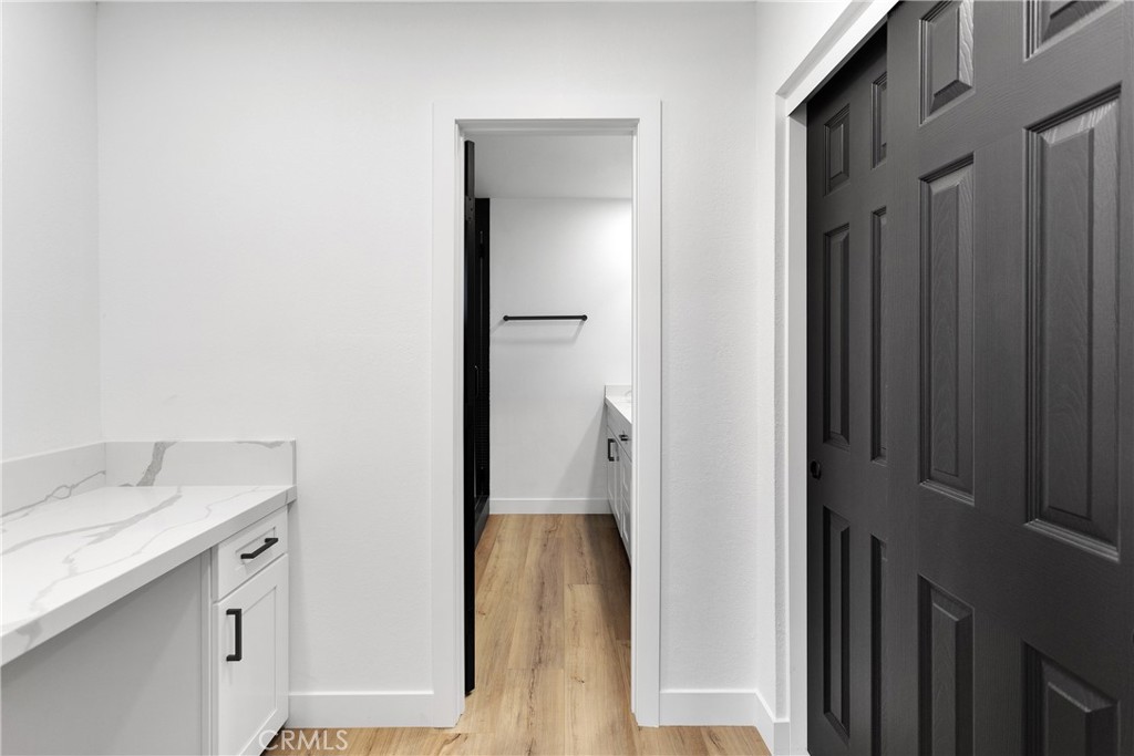 20717 Eyota Apple Valley, CA 92308 - Photo 23 of 38 a bathroom with a granite countertop sink and a mirror