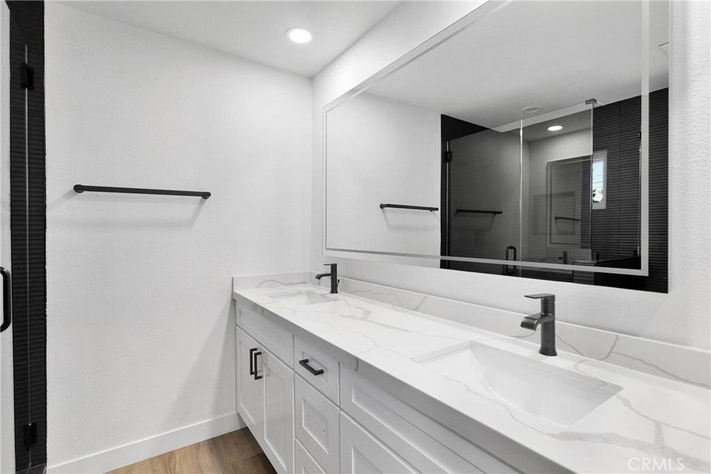20717 Eyota Apple Valley, CA 92308 - Photo 24 of 38 a bathroom with a sink and a mirror