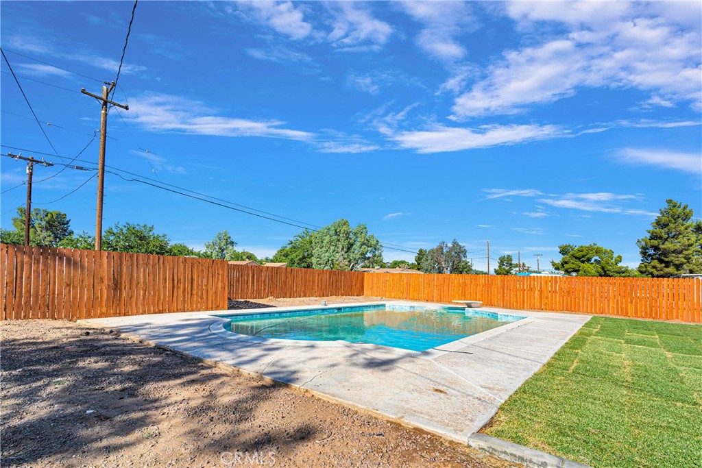20717 Eyota Apple Valley, CA 92308 - Photo 28 of 38 a view of swimming pool with a yard