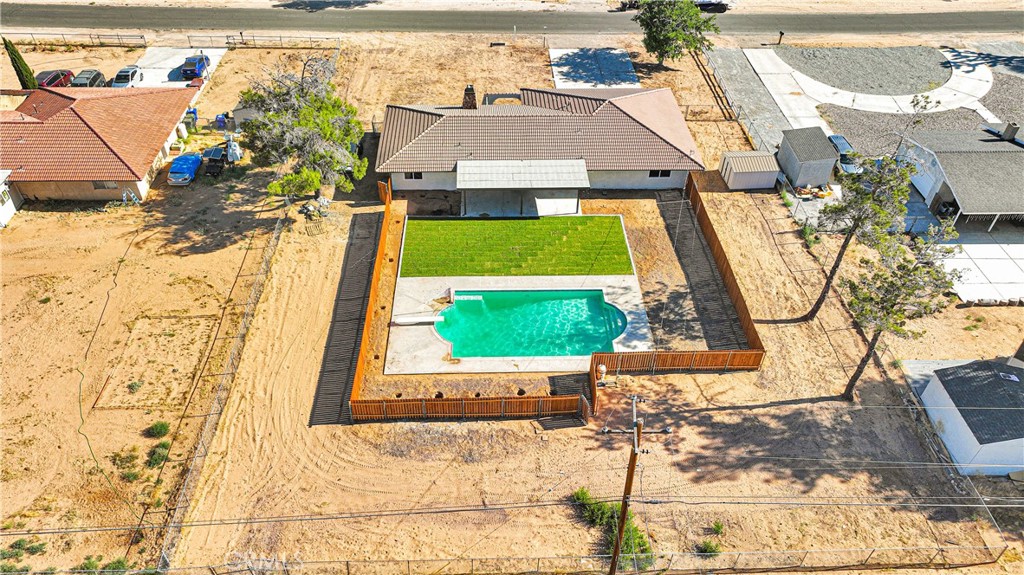 20717 Eyota Apple Valley, CA 92308 - Photo 35 of 38 a front view of a house with a garden