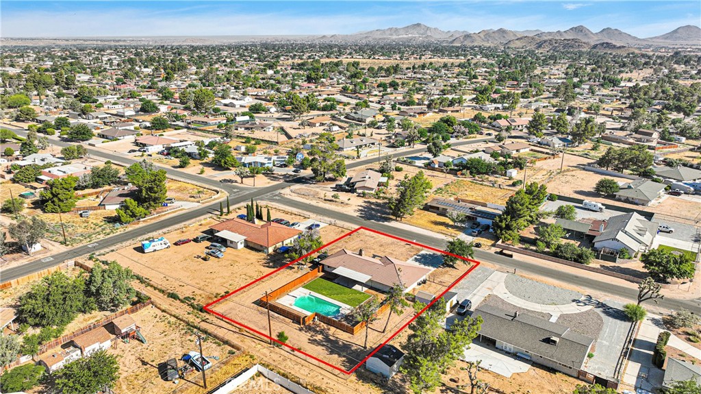 20717 Eyota Apple Valley, CA 92308 - Photo 38 of 38 an aerial view of residential building with parking space