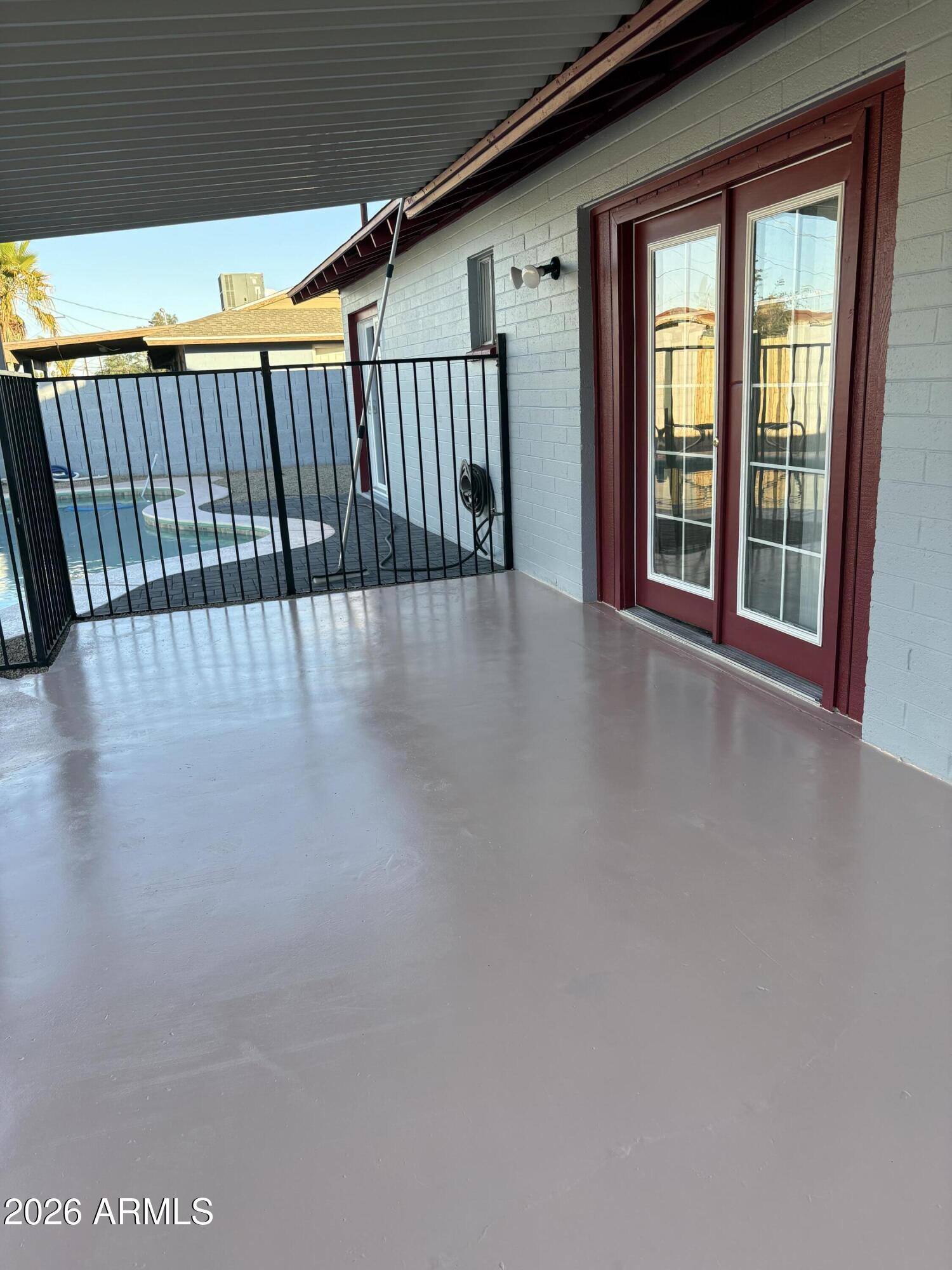 5440 Virginia Avenue Phoenix, AZ 85035 - Photo 13 of 15 a view of a porch with wooden floor and windows