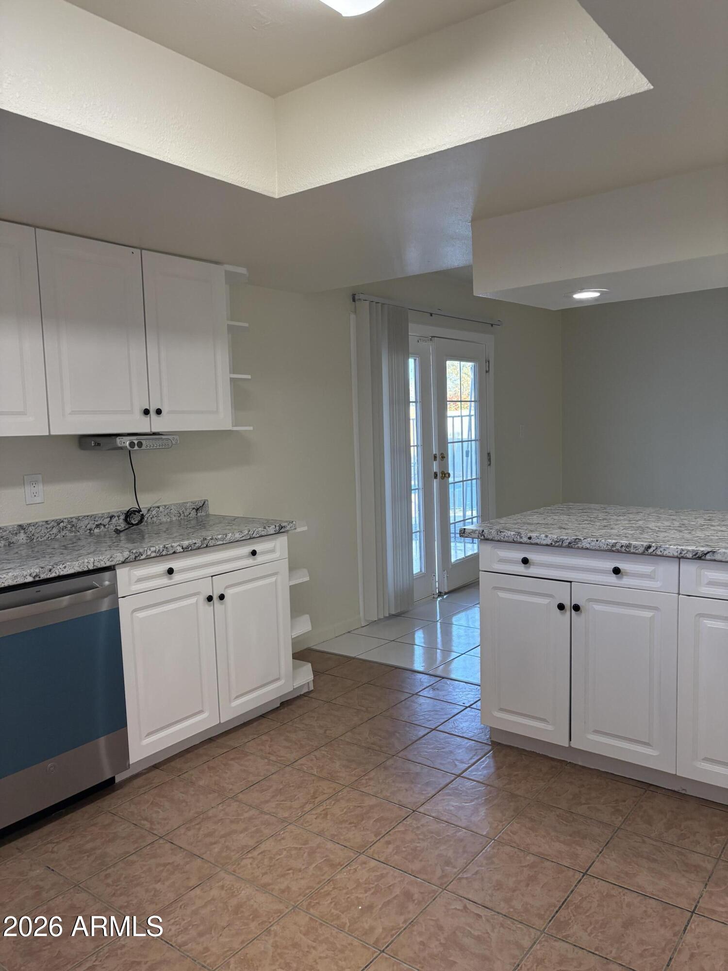 5440 Virginia Avenue Phoenix, AZ 85035 - Photo 6 of 15 a kitchen with cabinets stove and sink