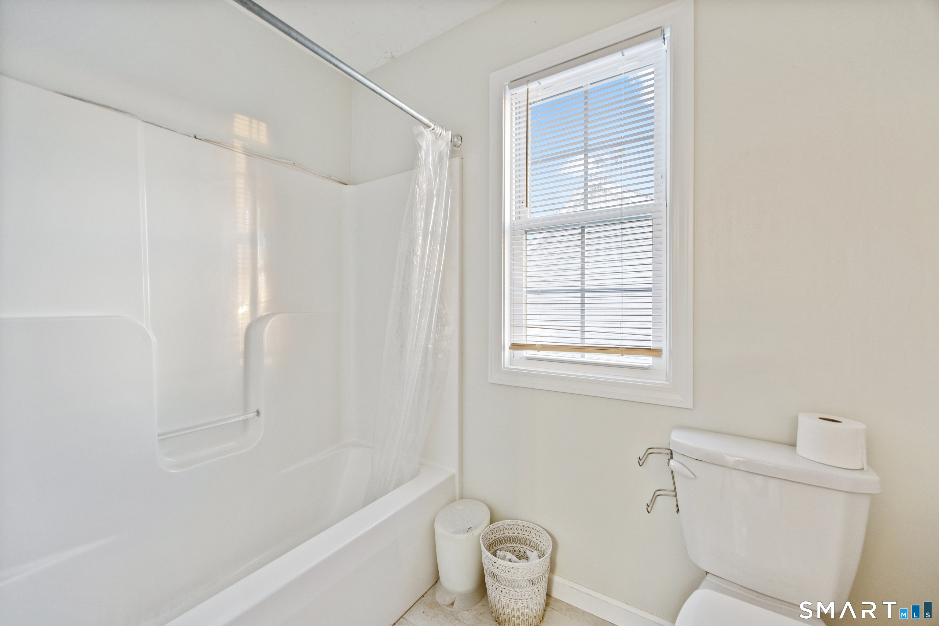 27 Amber Place Waterbury, CT 06705 - Photo 27 of 33 a bathroom with a toilet and a bathtub