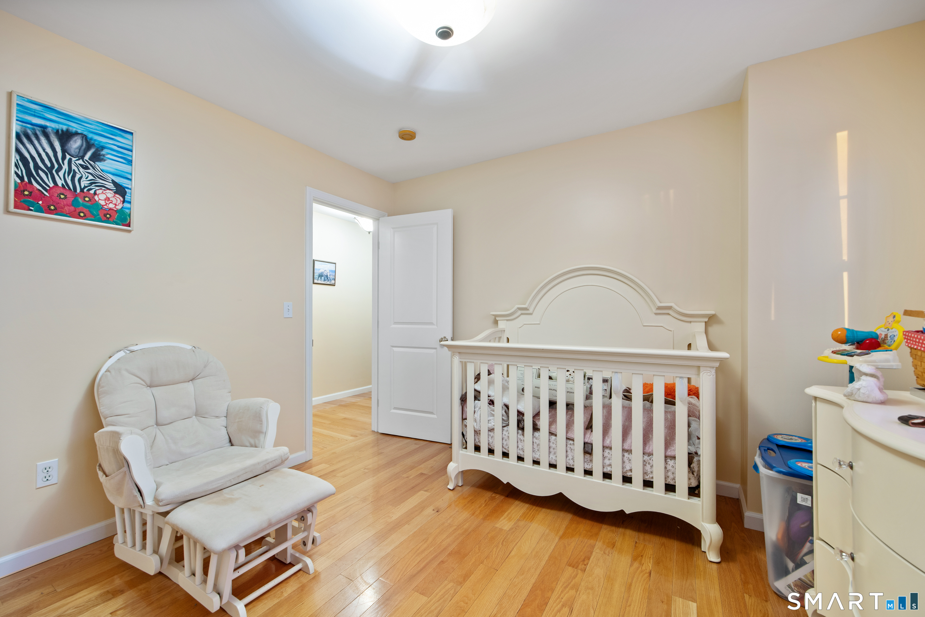 27 Amber Place Waterbury, CT 06705 - Photo 29 of 33 a bedroom with furniture and wooden floor