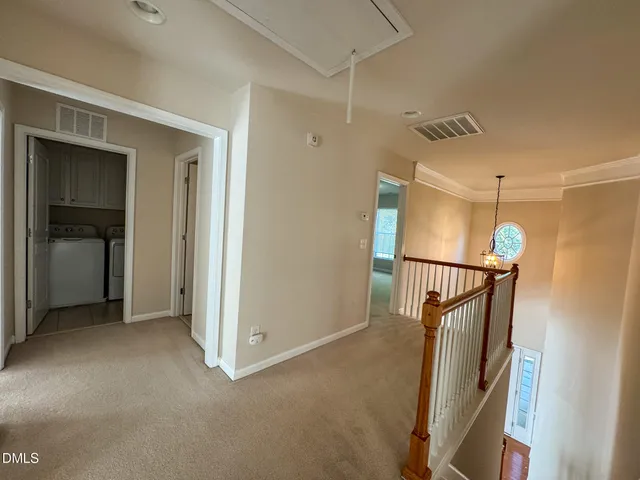 a view of a hallway with stairs