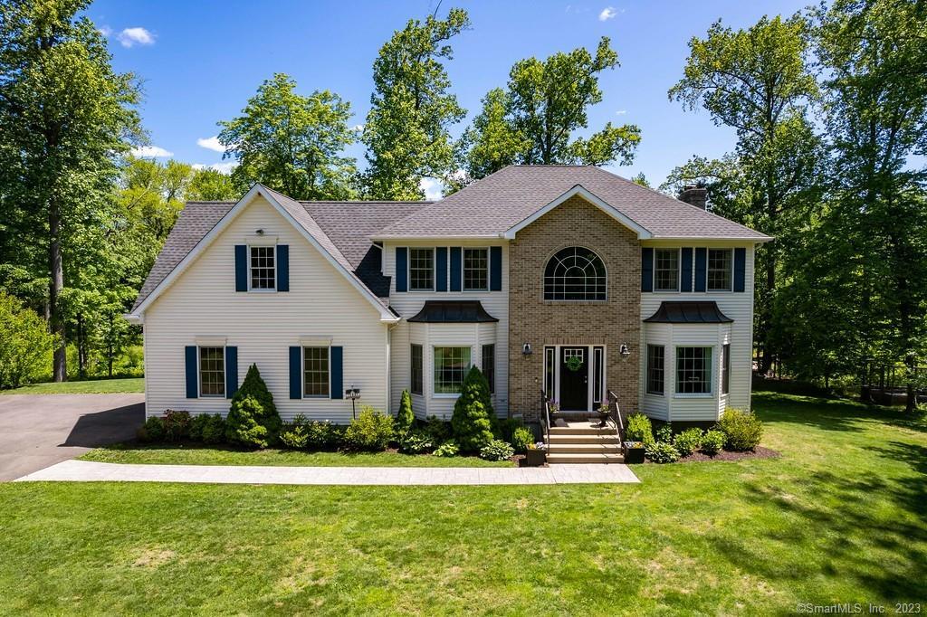 a front view of a house with a yard