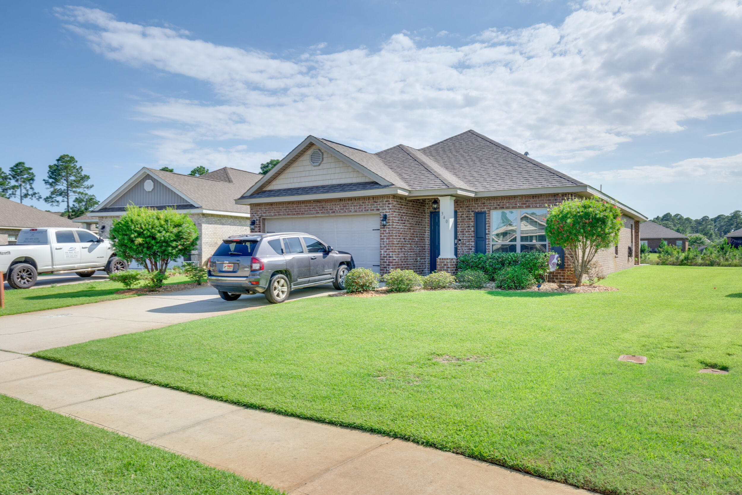 340 Pin Oak Loop Santa Rosa Beach, FL 32459 - Photo 1 of 52 a front view of a house with garden