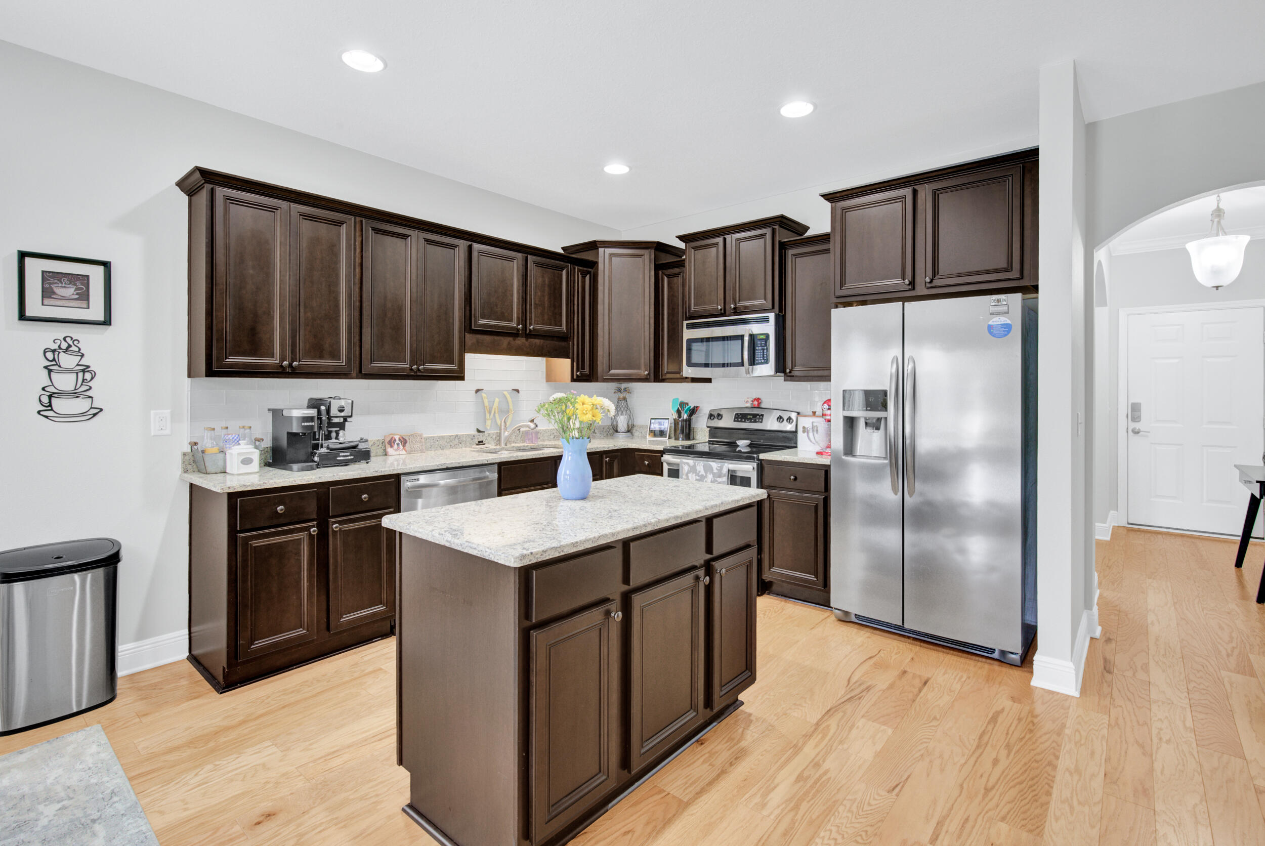 340 Pin Oak Loop Santa Rosa Beach, FL 32459 - Photo 16 of 52 a kitchen with kitchen island a sink stainless steel appliances and cabinets