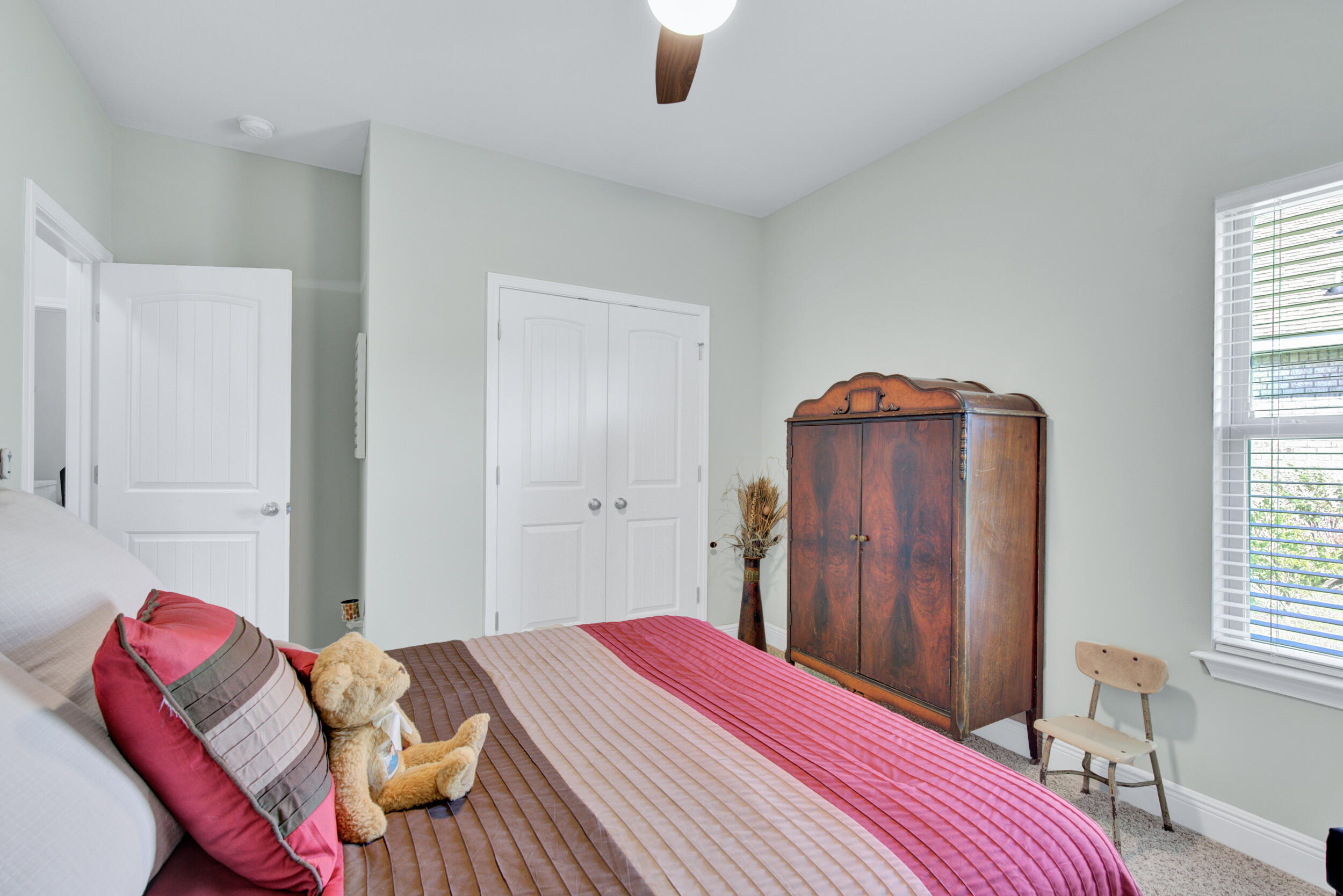 340 Pin Oak Loop Santa Rosa Beach, FL 32459 - Photo 30 of 52 a bedroom with a bed and a chair