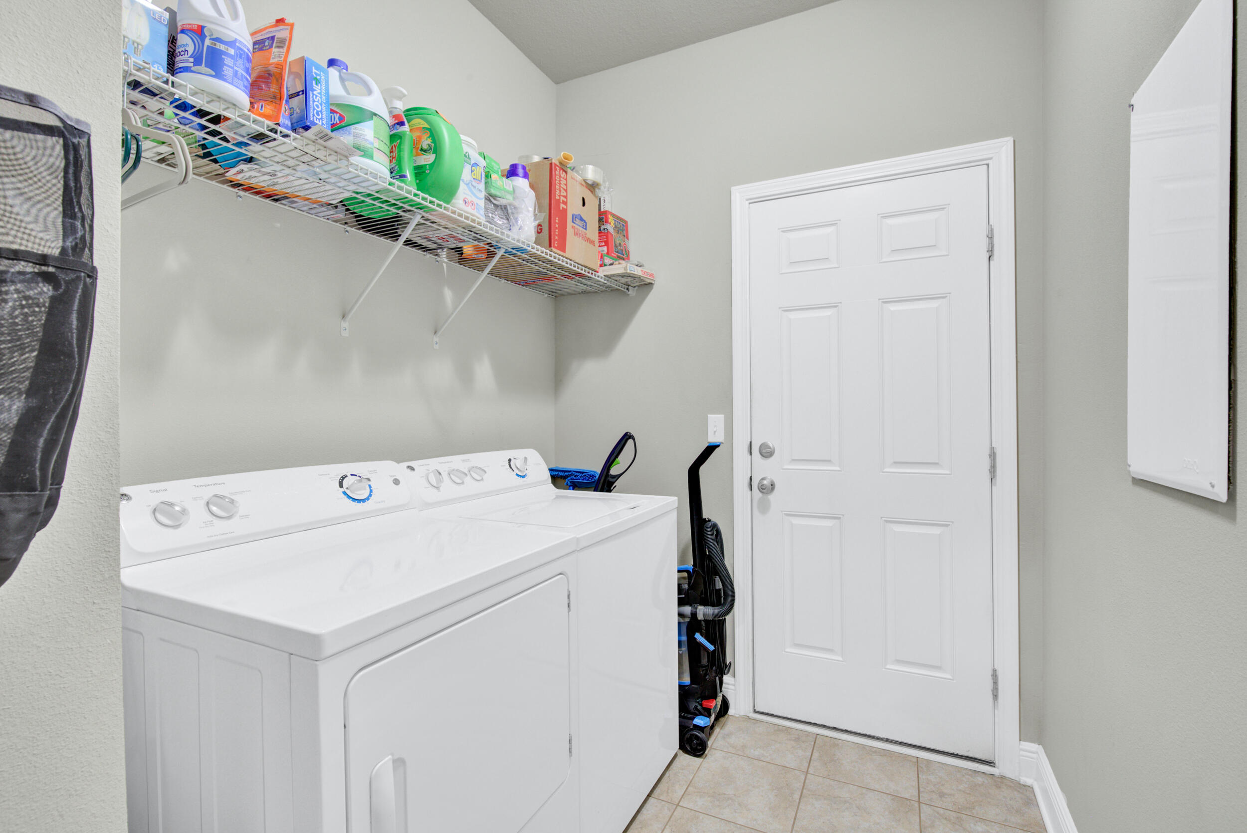 340 Pin Oak Loop Santa Rosa Beach, FL 32459 - Photo 33 of 52 a utility room with dryer and washer