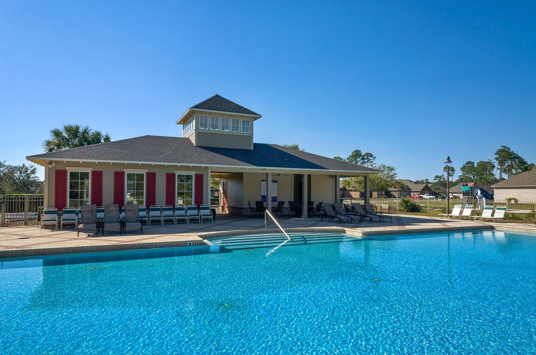 340 Pin Oak Loop Santa Rosa Beach, FL 32459 - Photo 35 of 52 a front view of a house with swimming pool having outdoor seating