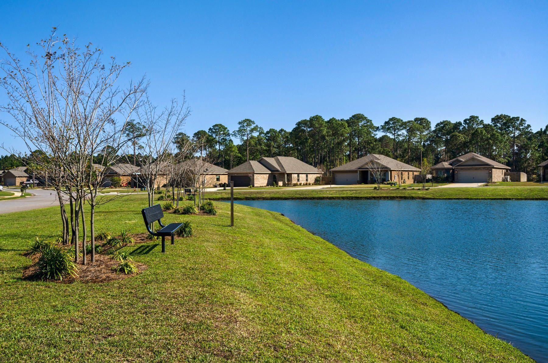 340 Pin Oak Loop Santa Rosa Beach, FL 32459 - Photo 38 of 52 a view of a lake with houses