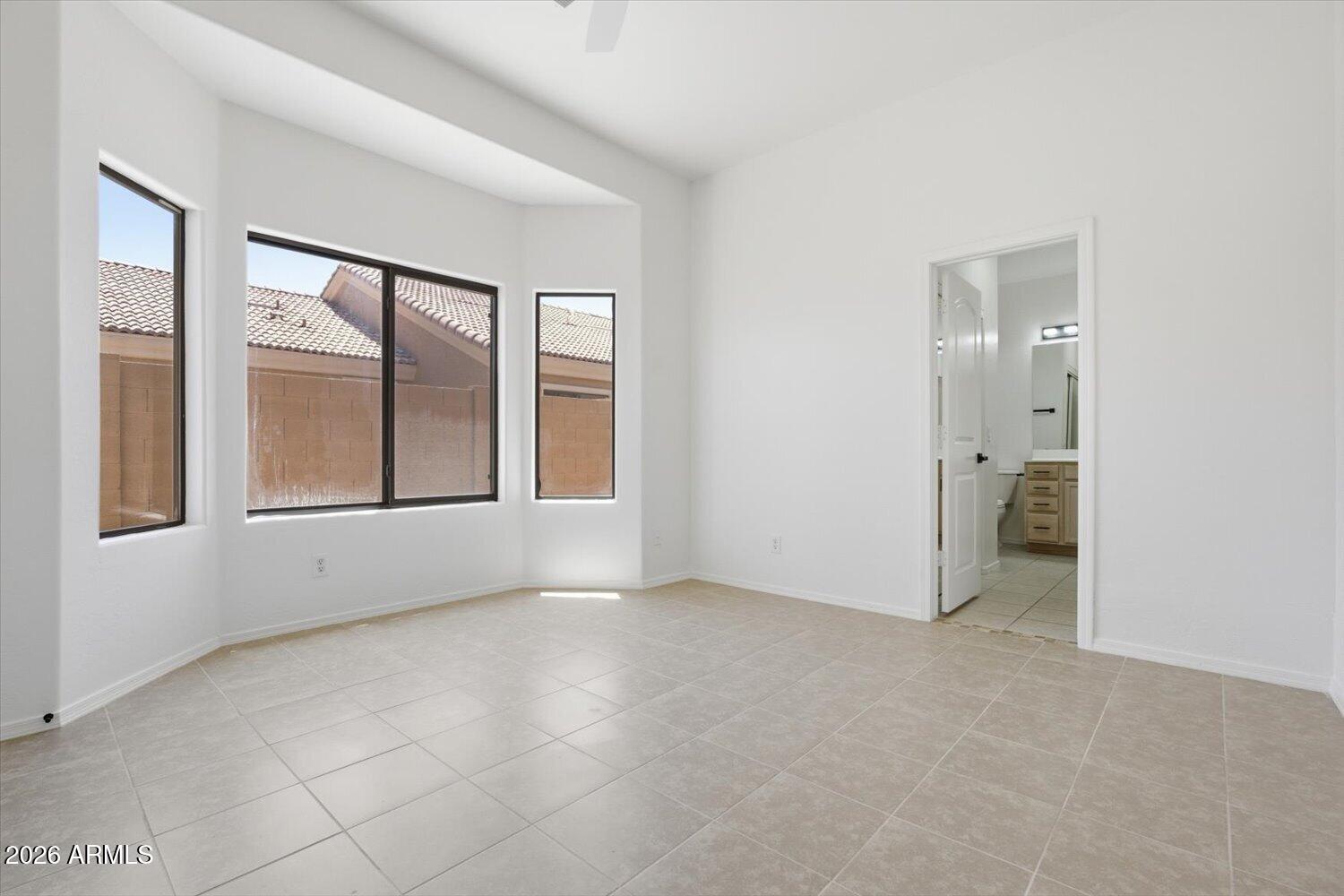 2565 South Signal Butte Road, Unit 23 Mesa, AZ 85209 - Photo 12 of 29 an empty room with windows and closet