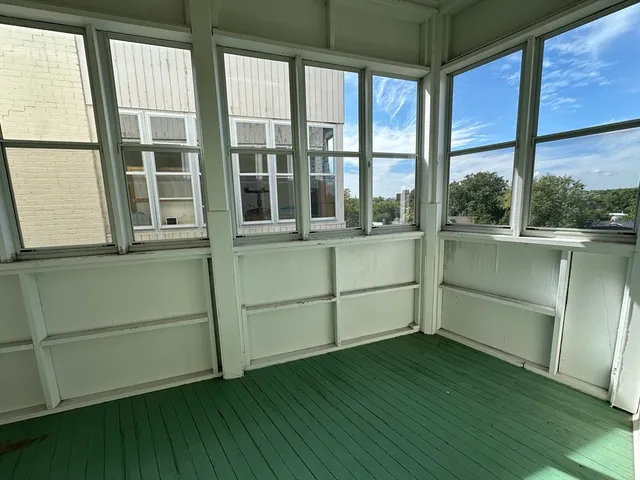 a room with window and wooden floor