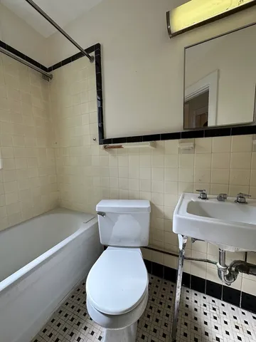 a bathroom with a toilet and a sink