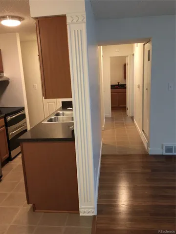 a view of a kitchen from the hallway