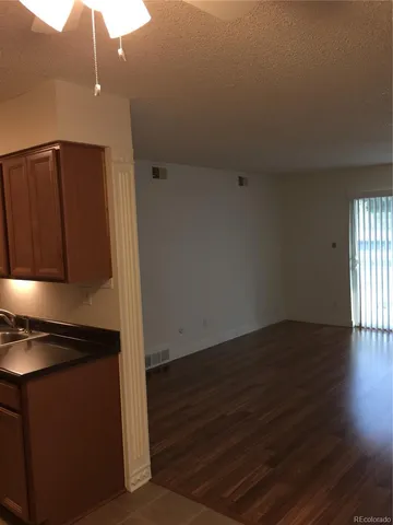 a kitchen that has a microwave oven on it and cabinets