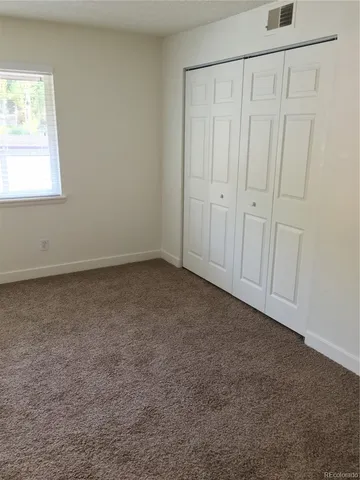 an empty room with a empty space and a window