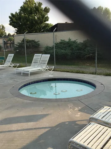 a view of a swimming pool with a patio