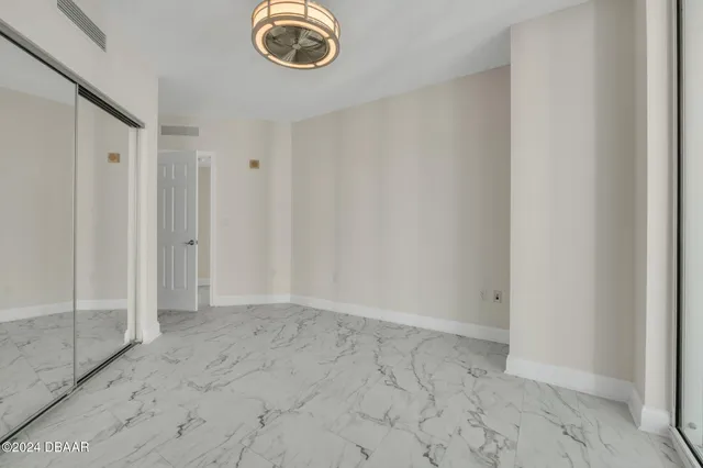 a view of an empty room and a window