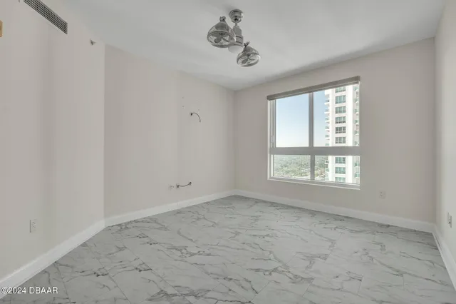 a view of an empty room with a window