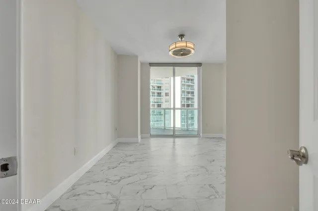 a view of an empty room with a window