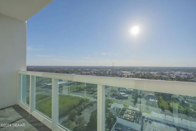 a view of a balcony with an ocean view