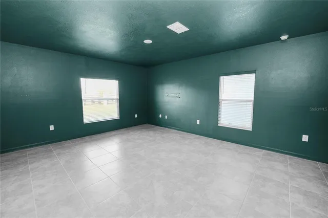 an empty room with windows