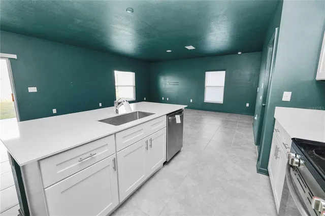 a bathroom with a sink a vanity and mirror