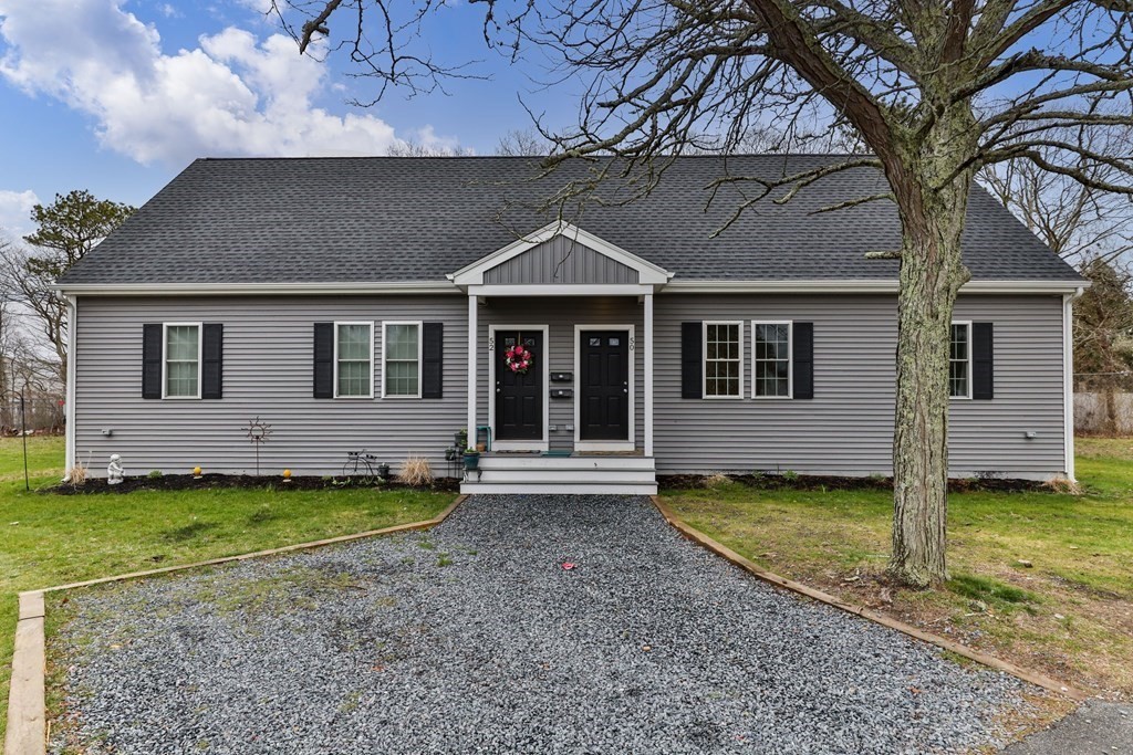 50 Fresh Holes Road Barnstable, MA 02601 - Photo 3 of 6 a front view of a house with a garden