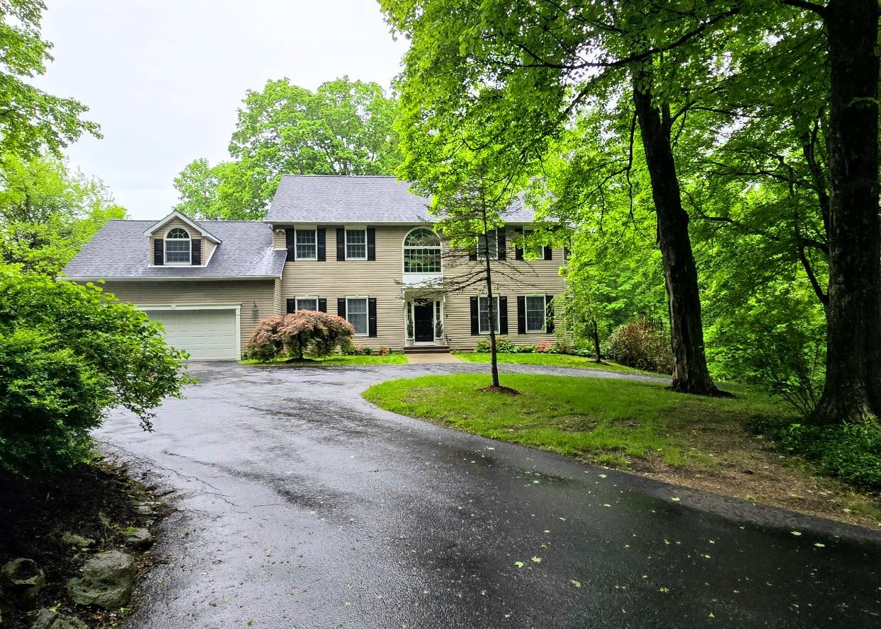 148 Couch Road Patterson, NY 10509 - Photo 1 of 1 Colonial-style house with cicular driveway, a front yard, and an attached 2 car garage