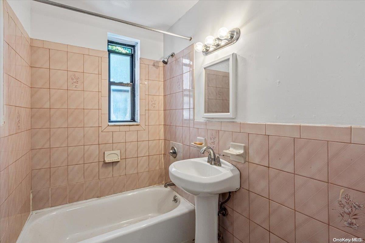 2860 Bailey Avenue, Unit 4F Bronx, NY 10463 - Photo 13 of 19 a bathroom with a sink a toilet and shower