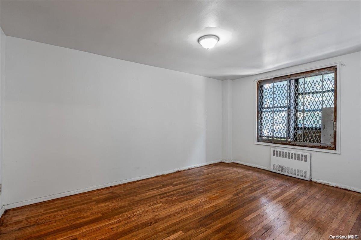 2860 Bailey Avenue, Unit 4F Bronx, NY 10463 - Photo 14 of 19 wooden floor in an empty room with a window