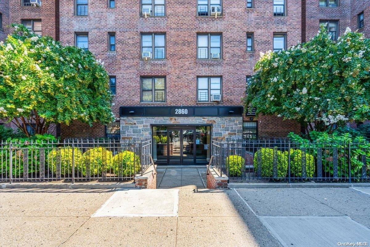 2860 Bailey Avenue, Unit 4F Bronx, NY 10463 - Photo 2 of 19 a building with potted plants in front of it