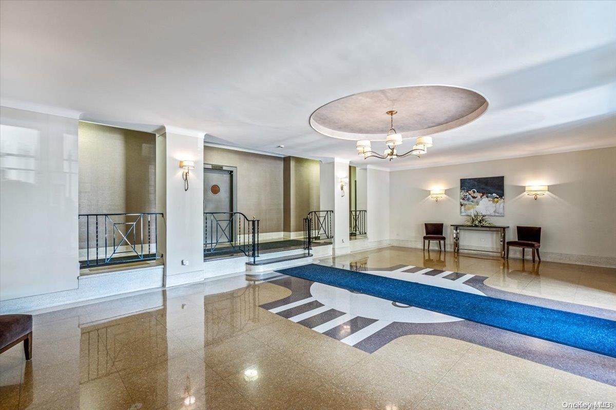 2860 Bailey Avenue, Unit 4F Bronx, NY 10463 - Photo 3 of 19 a living room with furniture and a chandelier