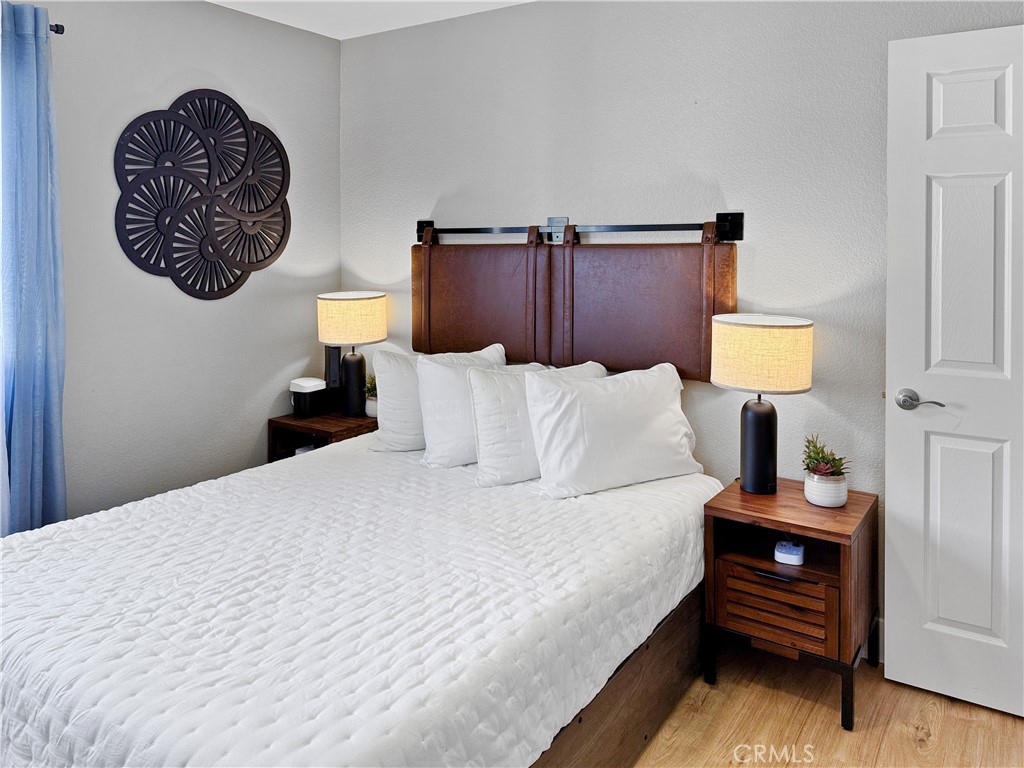 16955 Lake Knoll Parkway Riverside, CA 92503 - Photo 31 of 42 a bedroom with a bed and a lamp on table