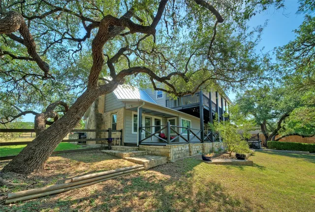 a view of a backyard and floor to ceiling window