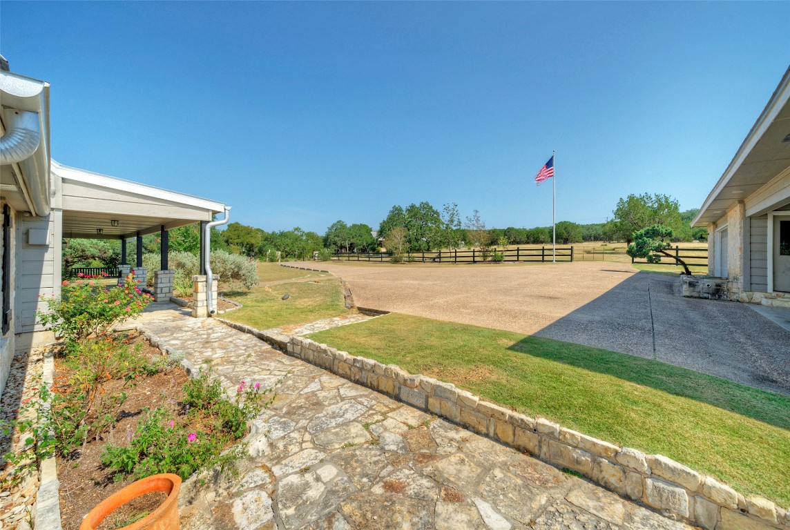 101 Arrowlake Road Wimberley, TX 78676 - Photo 14 of 40 a view of a backyard and floor to ceiling window